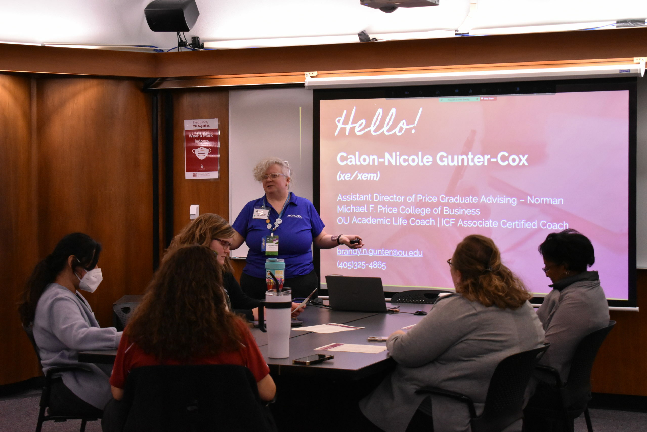 A presenter speaking to advisors in a small group session